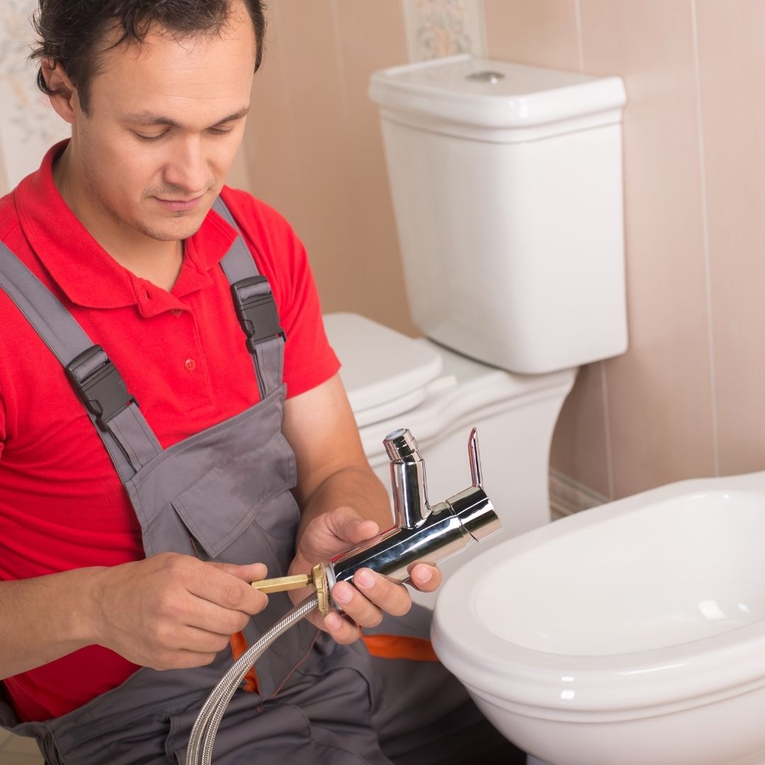 plumber working on bathroom